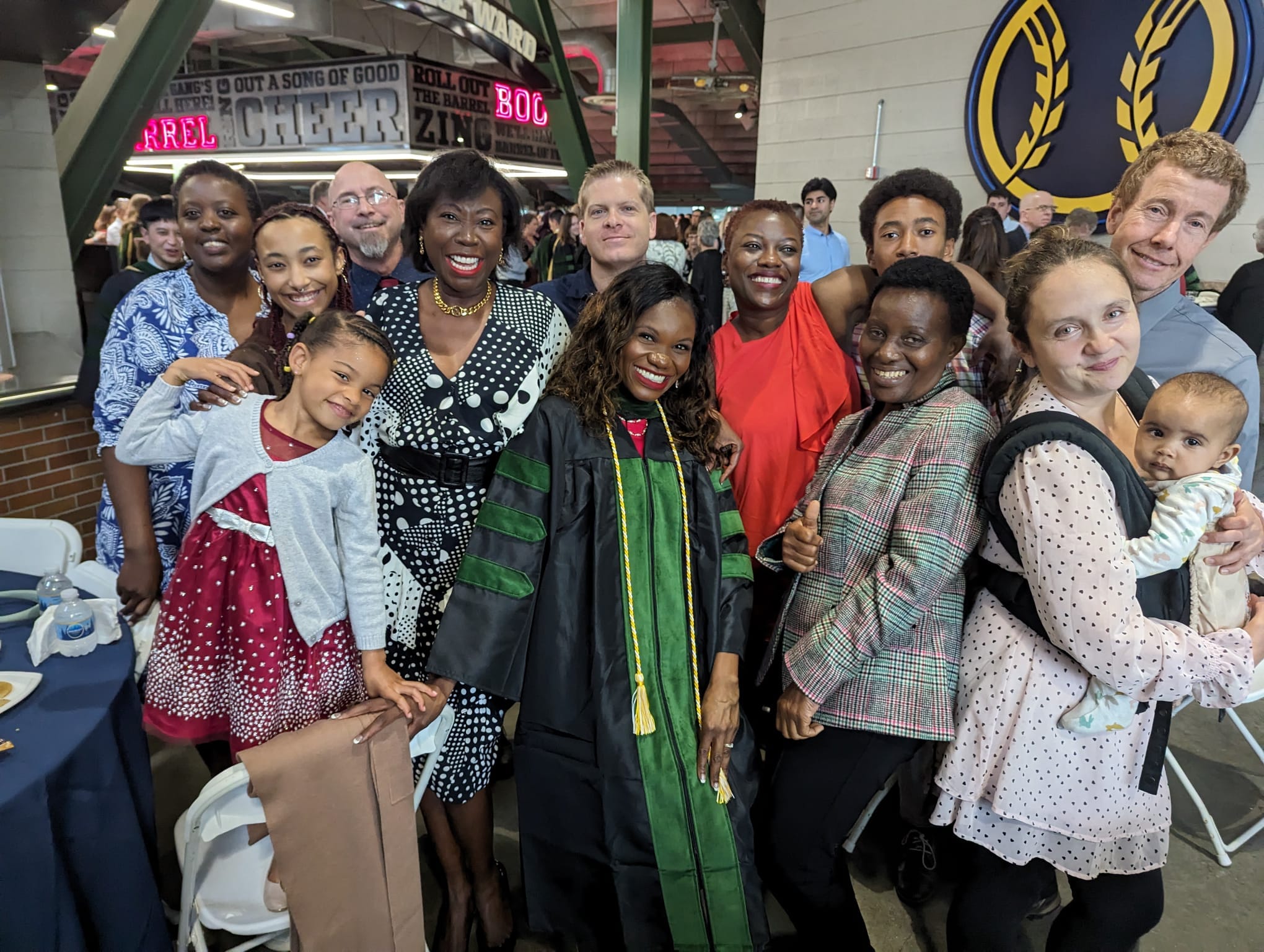 A group of people celebrating one of the members of the Organisation of Zambians Abroad